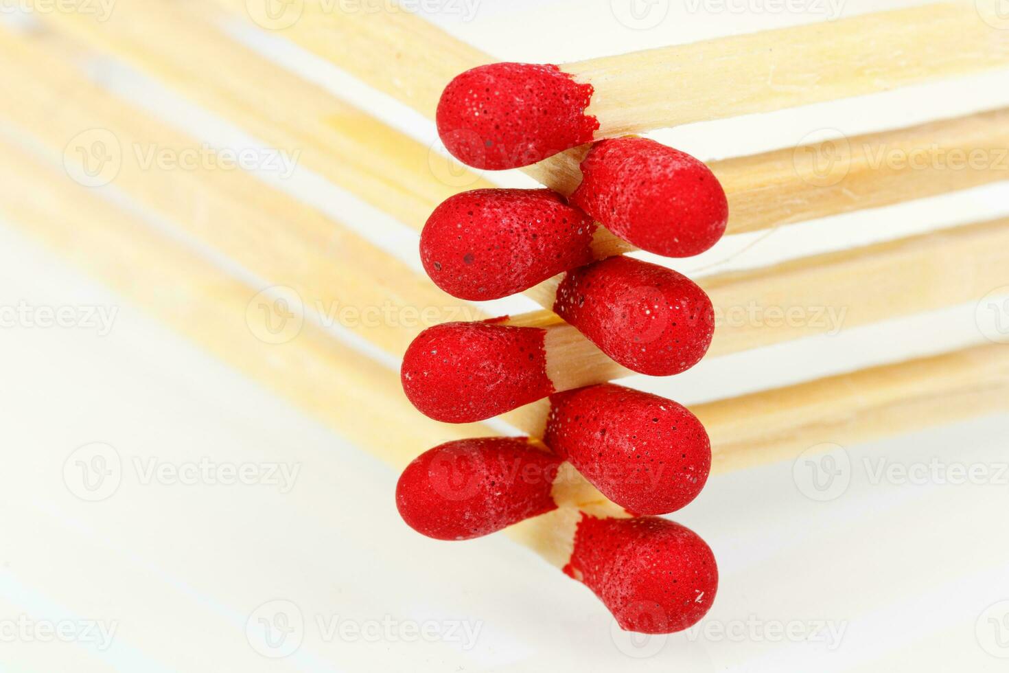 matches with a red head on a white background photo