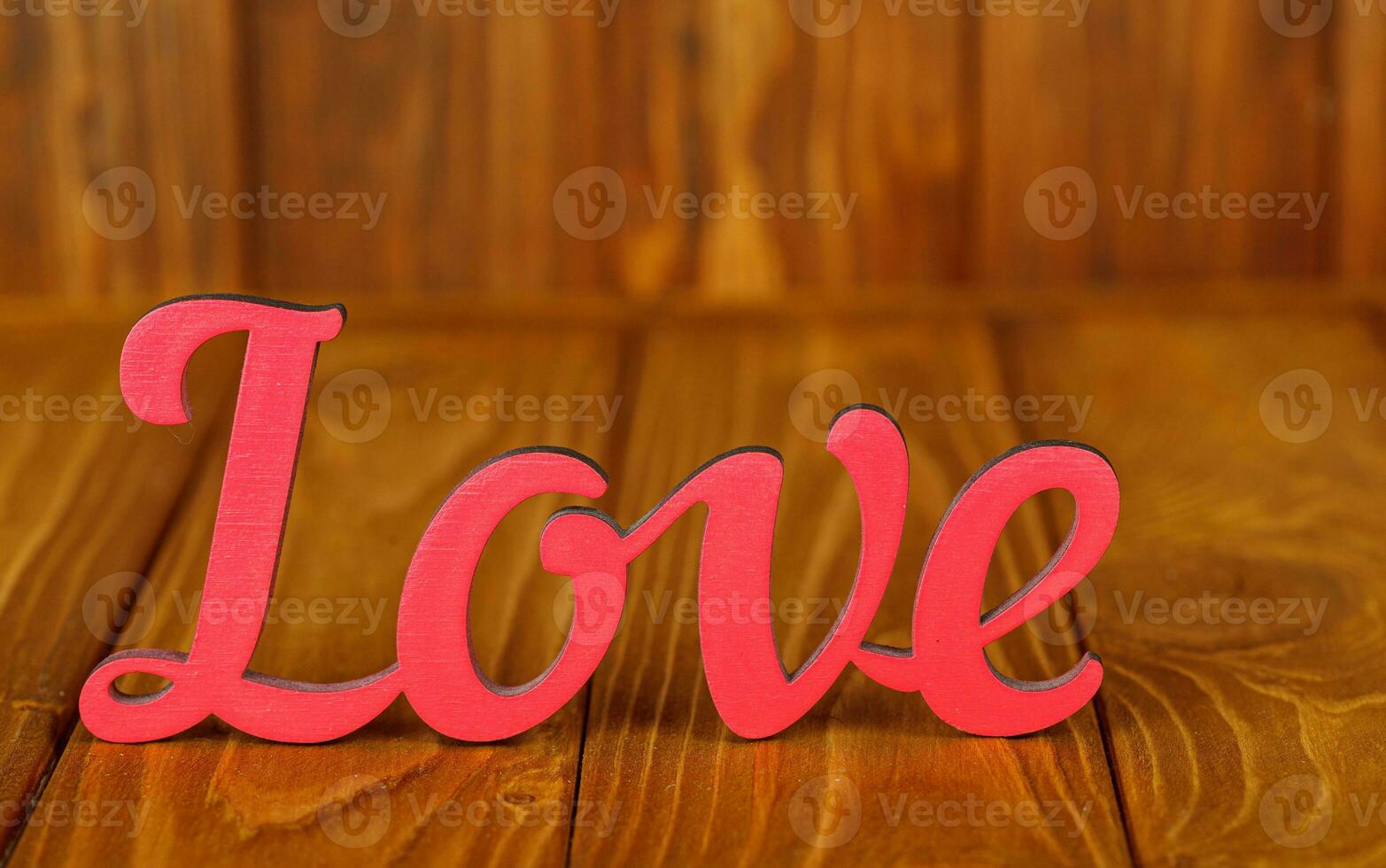 wooden inscription I love you on a wooden background photo