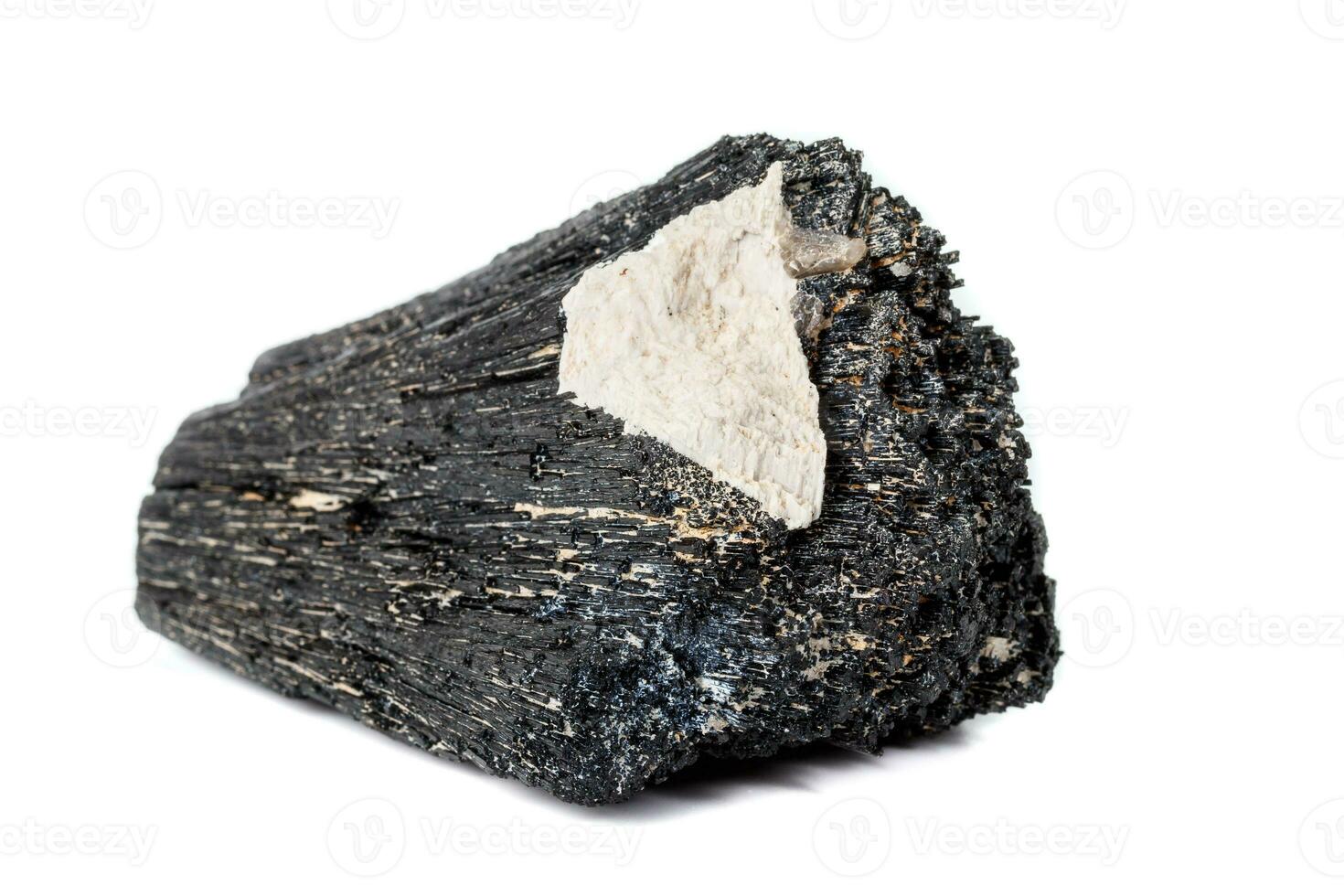 Macro mineral stone Schorl, Black Tourmaline on a white background photo