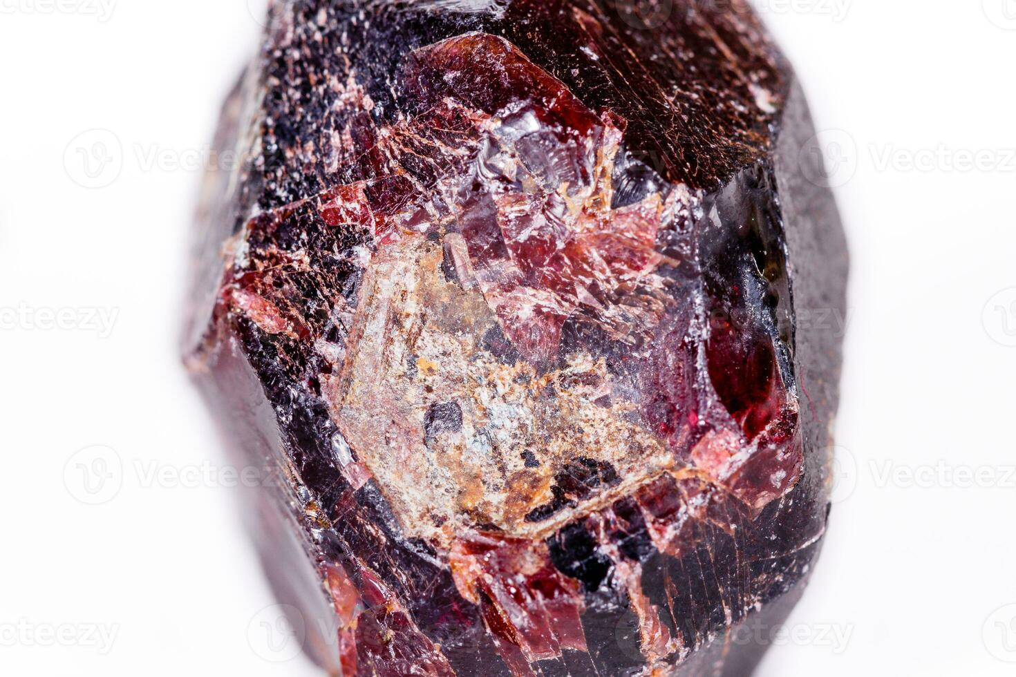 Macro of a mineral garnet stone on a white background photo
