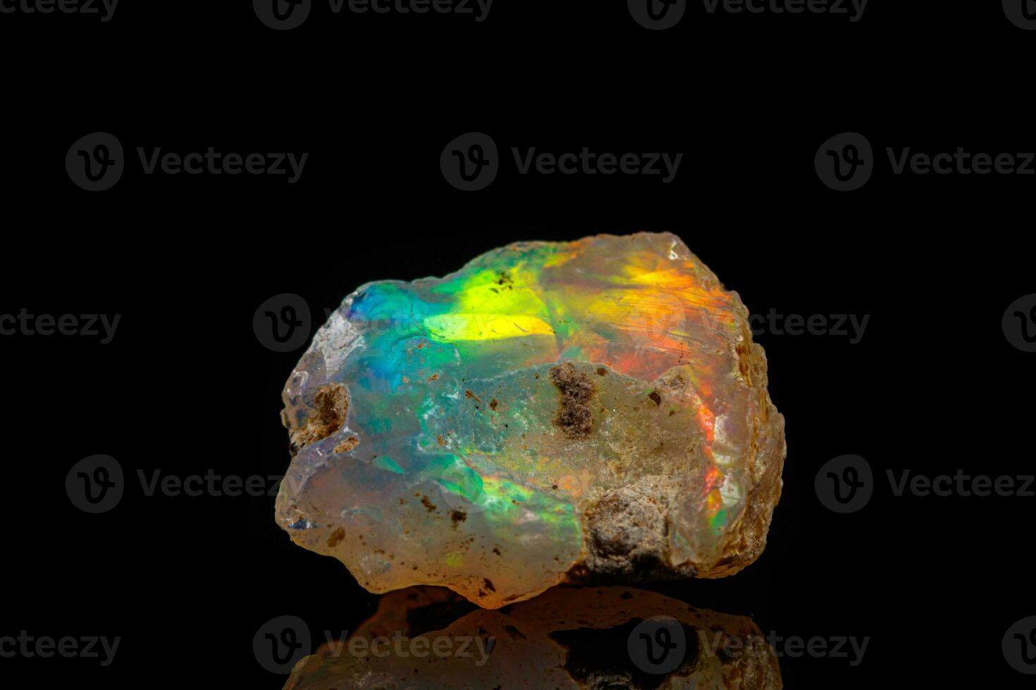 macro mineral stone rare and beautiful opals on a black background photo