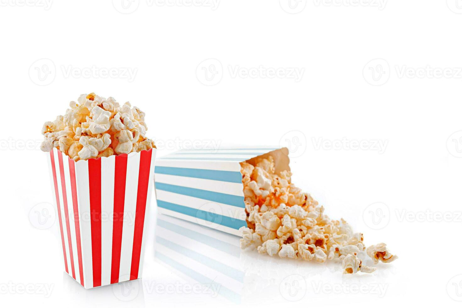 Glass with popcorn on a white background photo