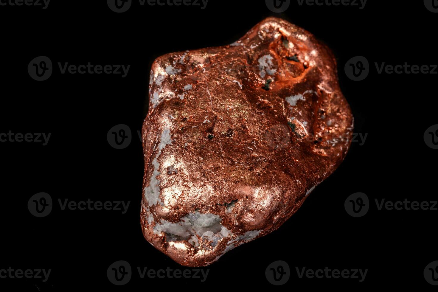 Macro mineral stone of a copper nugget on a microcline on a black background photo