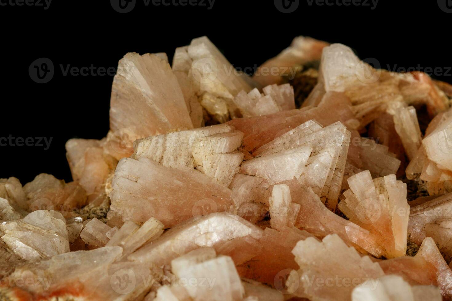 Macro of a stone Stilbite mineral on a black background photo