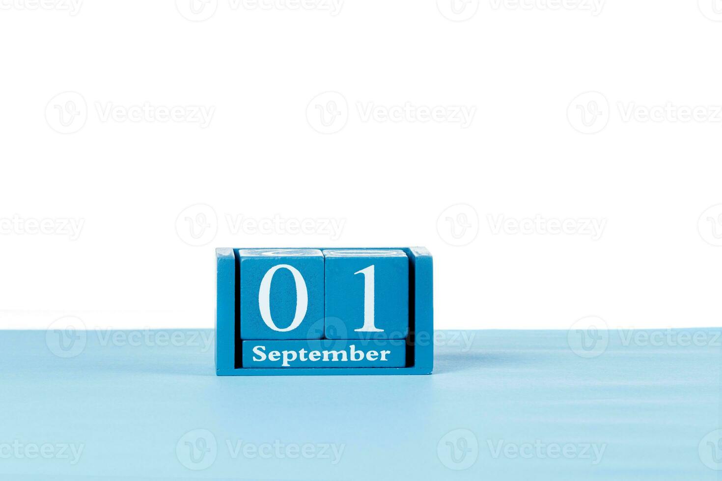 Wooden calendar September 01 on a white background photo