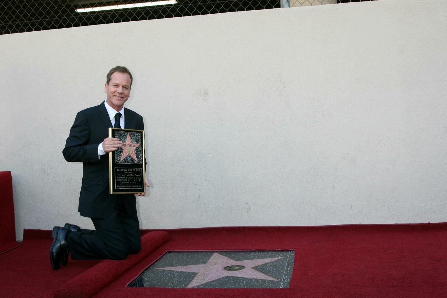 Kiefer Sutherland  Joel Schumacher at the Hollywood Walk of Fame ceremony for Kiefer Sutherland in Hollywood CA December 9 2008 photo