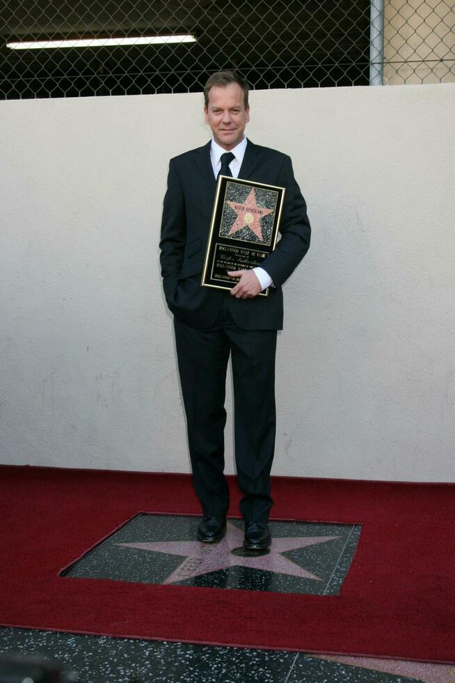 Kiefer Sutherland  Joel Schumacher at the Hollywood Walk of Fame ceremony for Kiefer Sutherland in Hollywood CA December 9 2008 photo