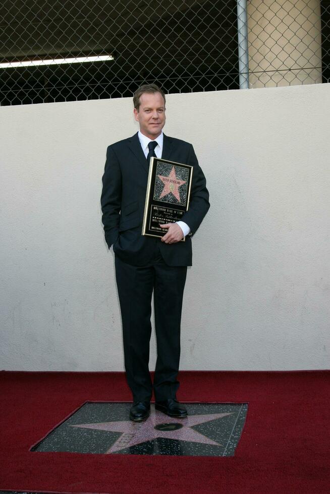 Kiefer Sutherland  Joel Schumacher at the Hollywood Walk of Fame ceremony for Kiefer Sutherland in Hollywood CA December 9 2008 photo