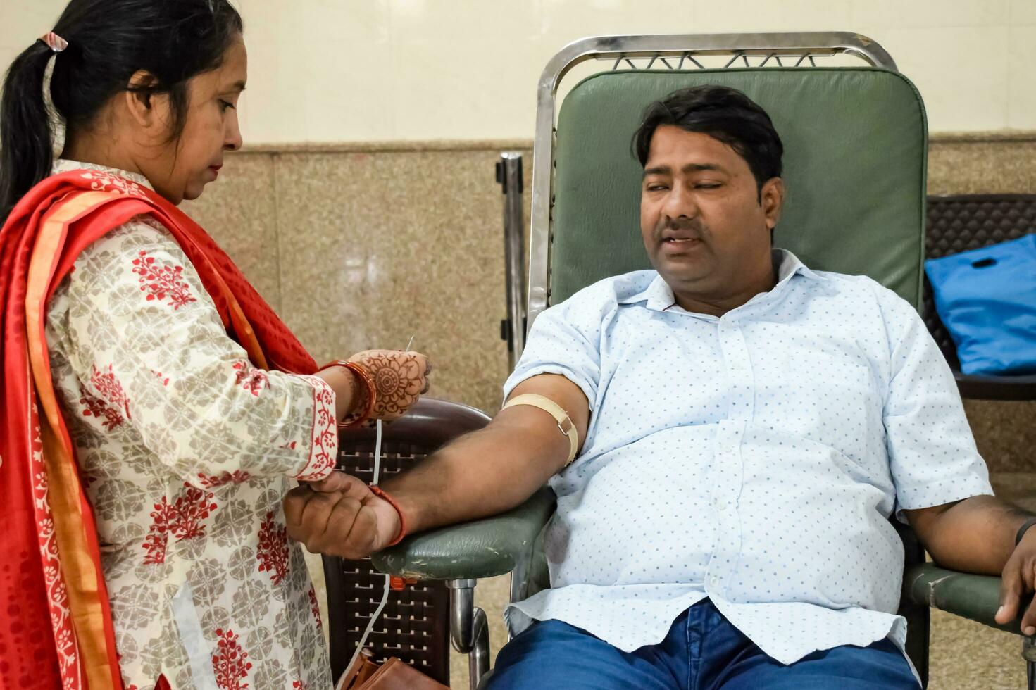Delhi, India, June 19 2023 - Blood donor at Blood donation camp held at Balaji Temple, Vivek Vihar, Delhi, India, Image for World blood donor day on June 14 every year, Blood Donation Camp at Temple photo