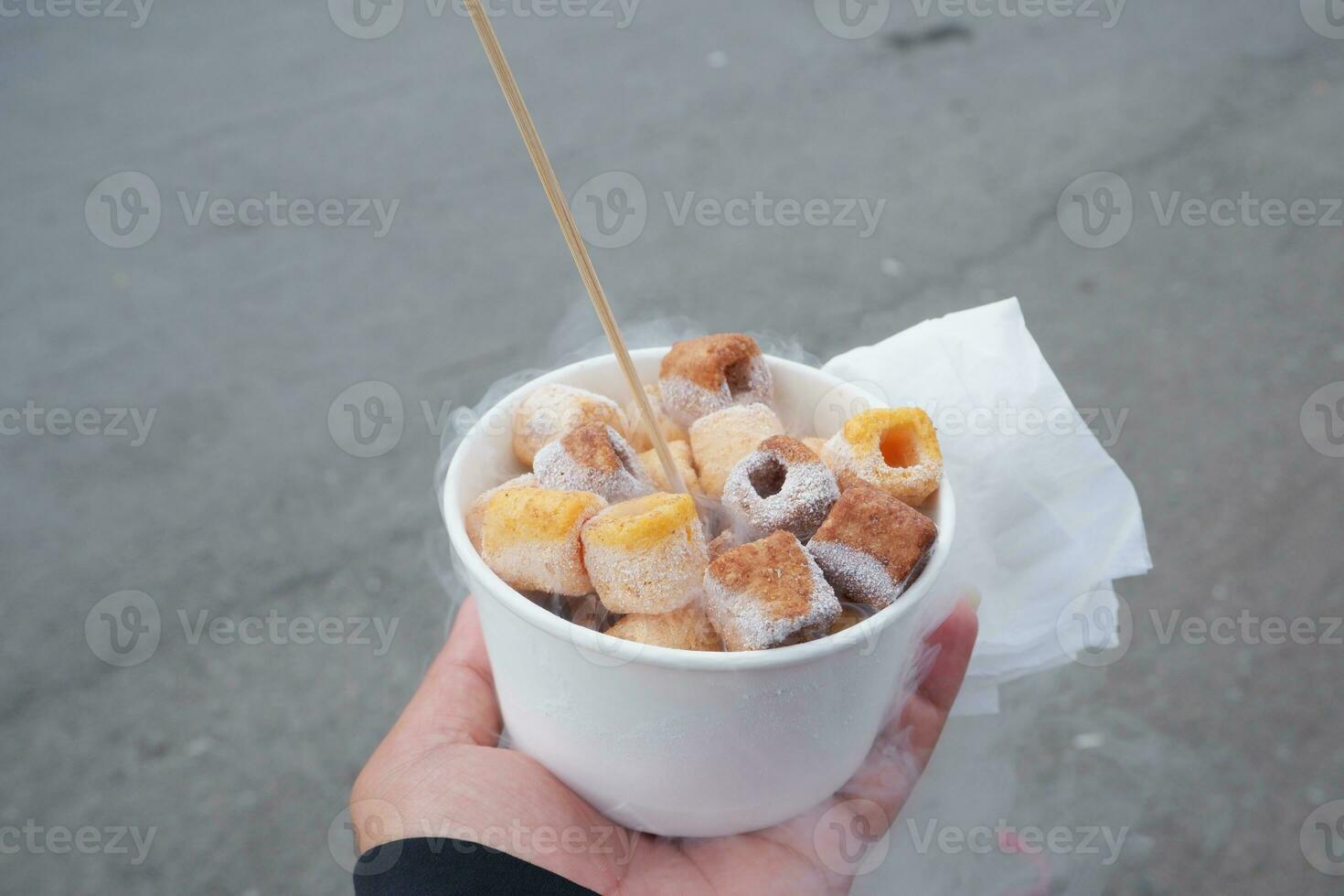 Ice smoke snacks in Indonesia are called ciki ngebul. Children's snacks given liquid nitrogen are dangerous to health photo
