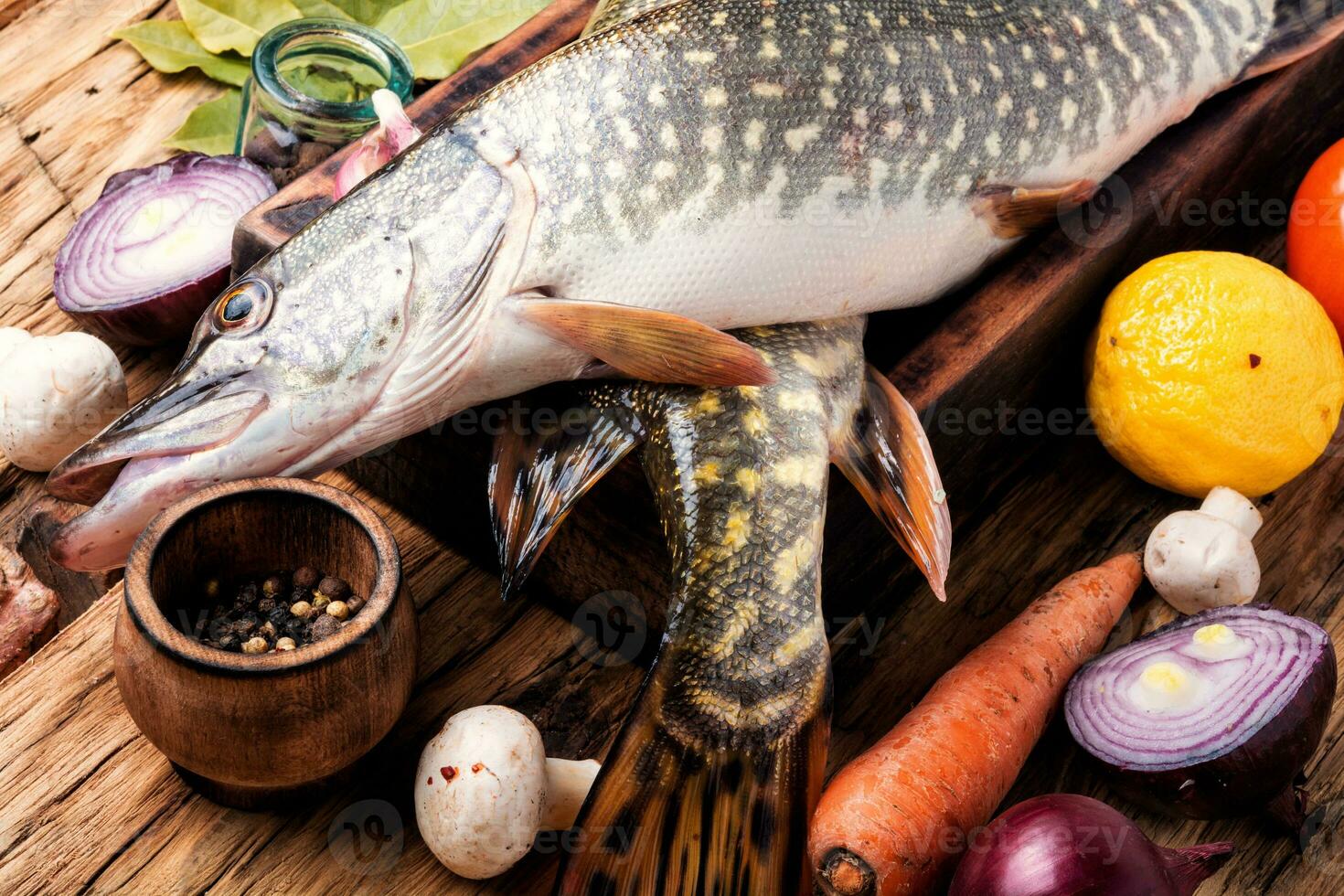 Fish pike on the kitchen board photo