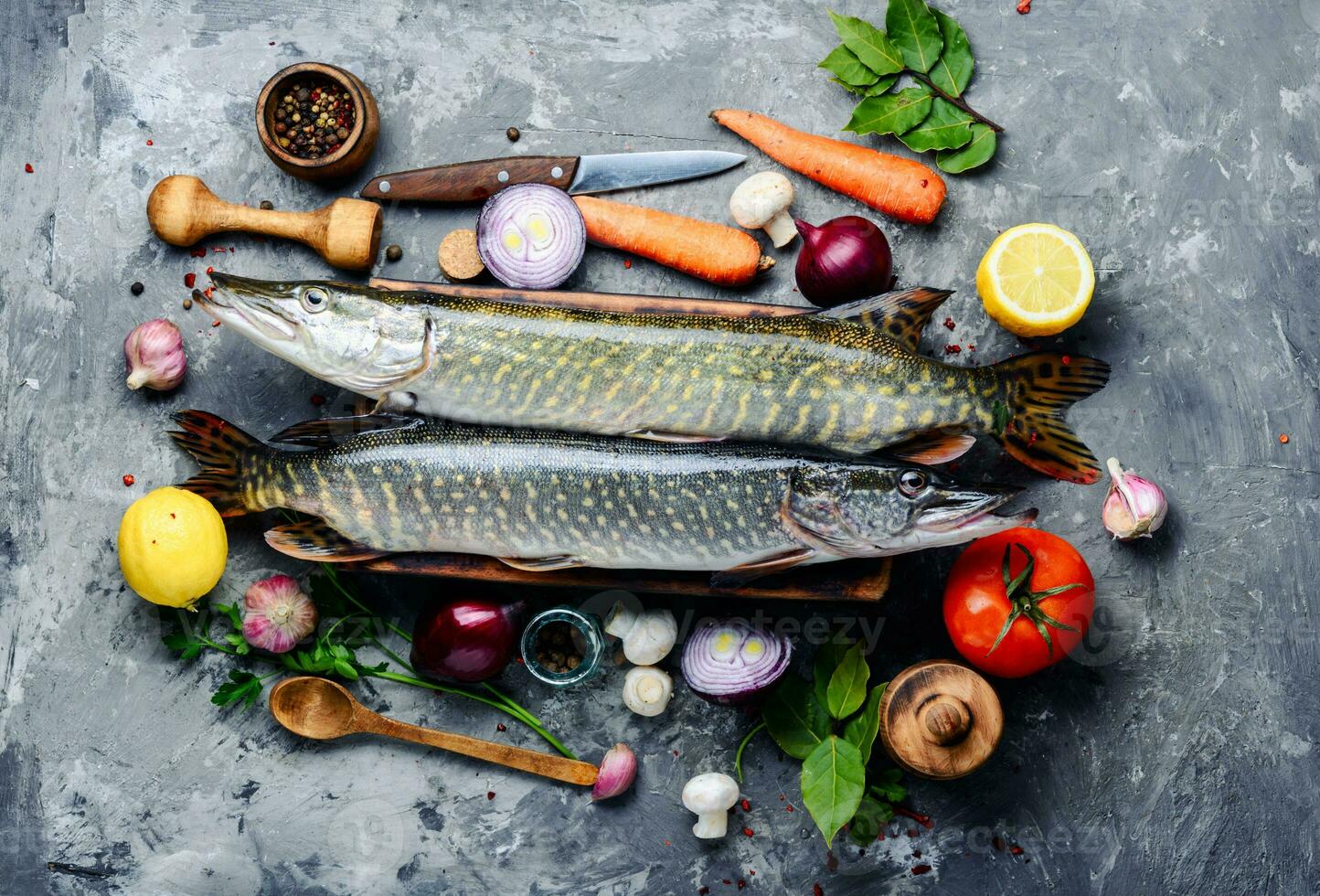 Fish pike on the kitchen board photo