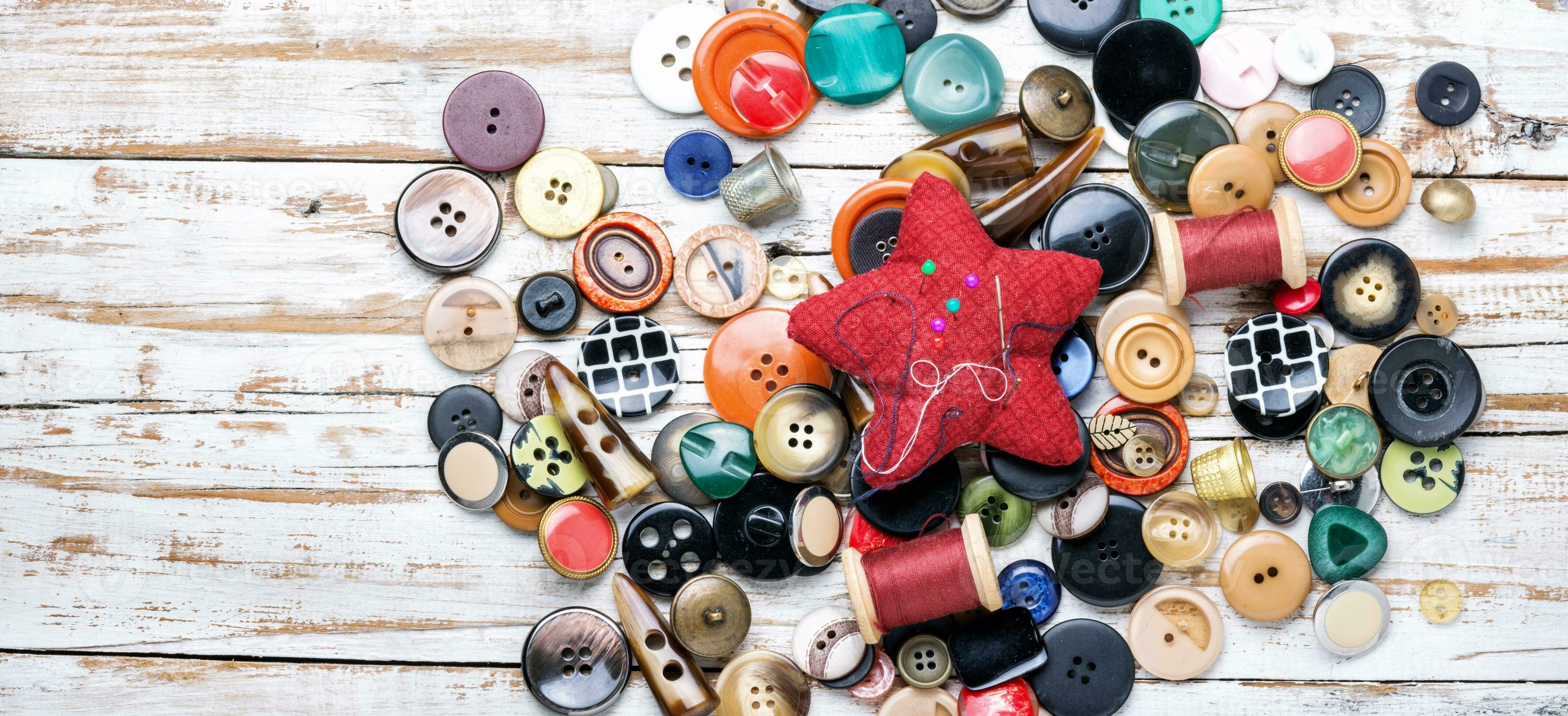 Buttons and threads with needle 34496532 Stock Photo at Vecteezy