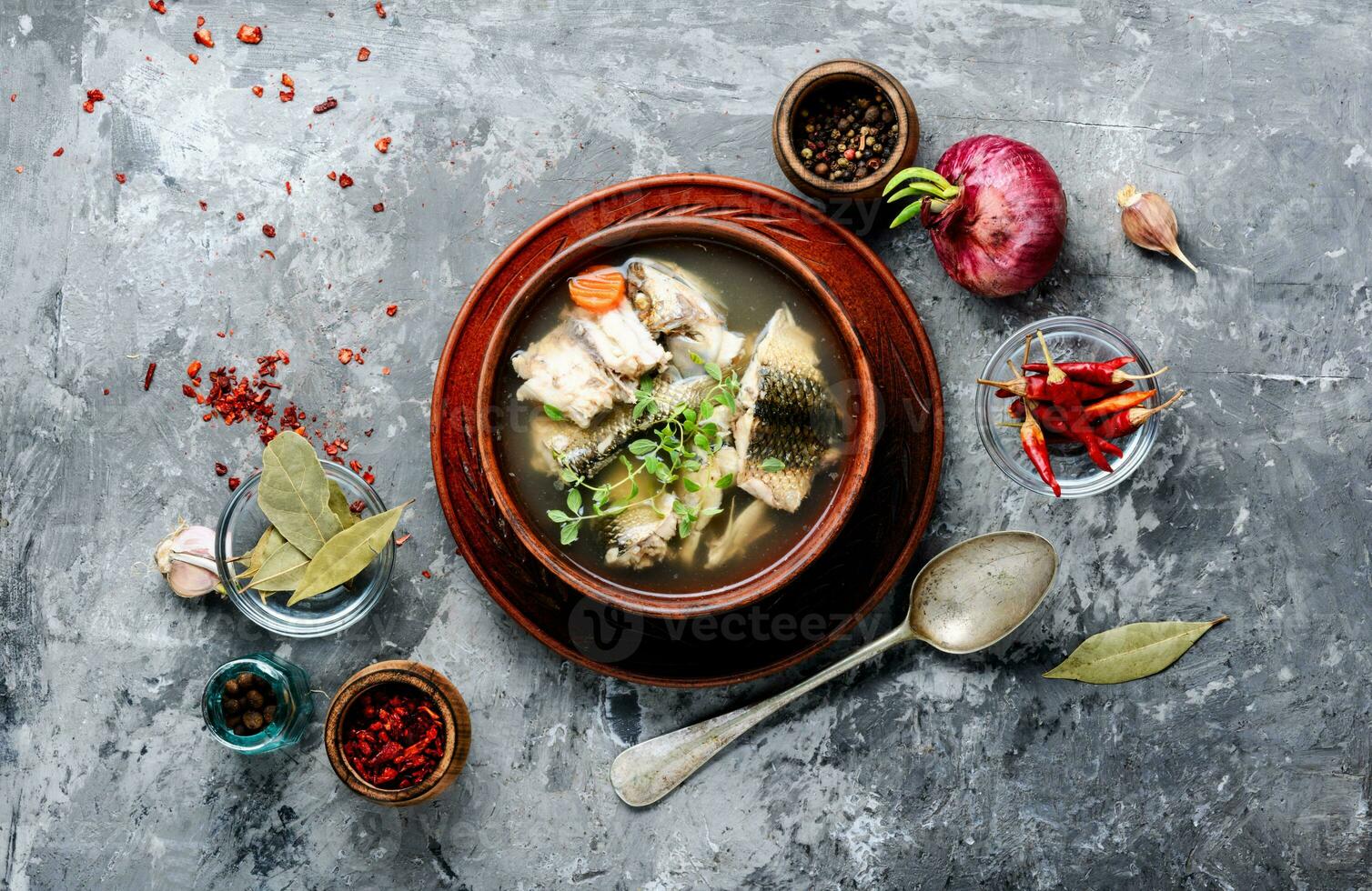 Ceramic bowl with fish soup photo