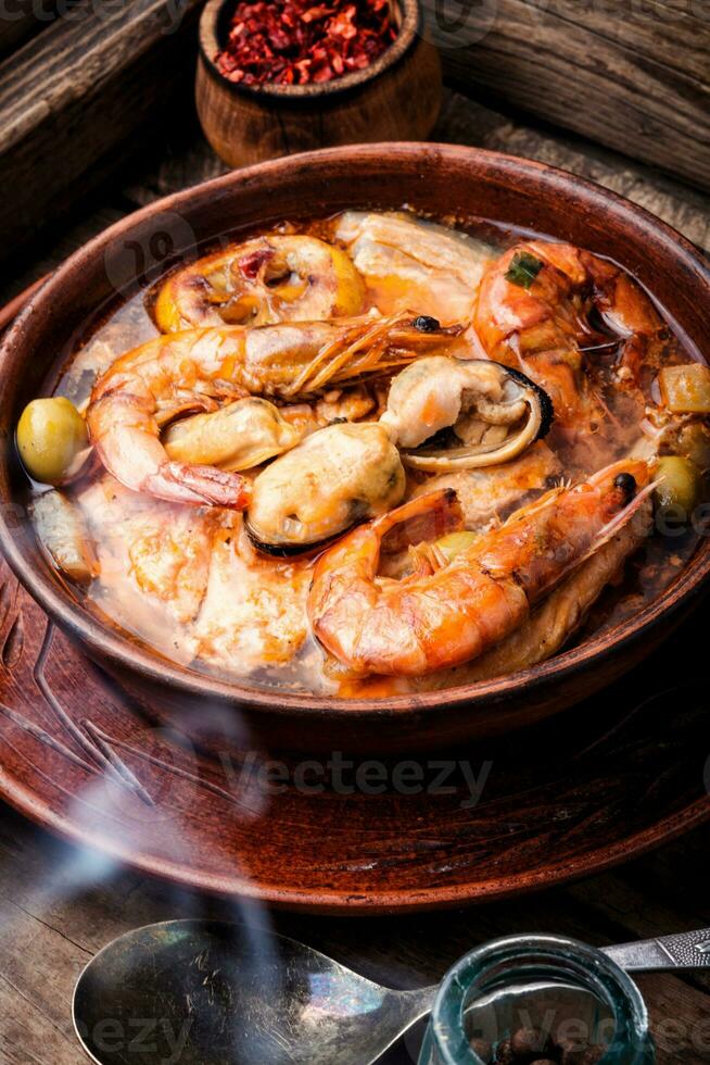 Bowl of fresh seafood soup photo