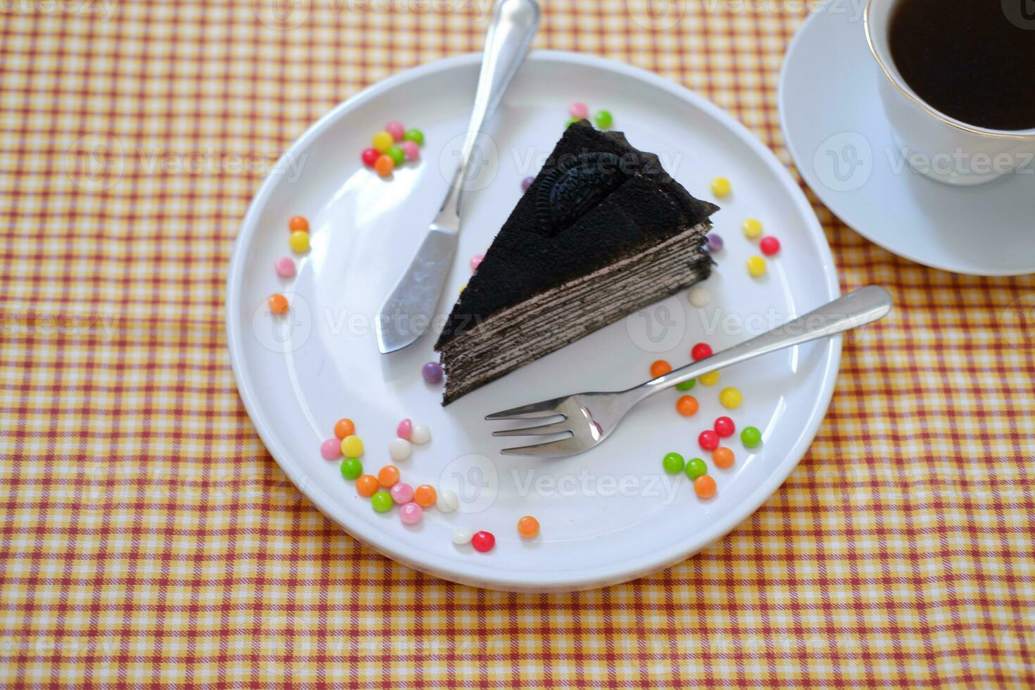 Piece of homemade chocolate crepes cake on a white plate photo