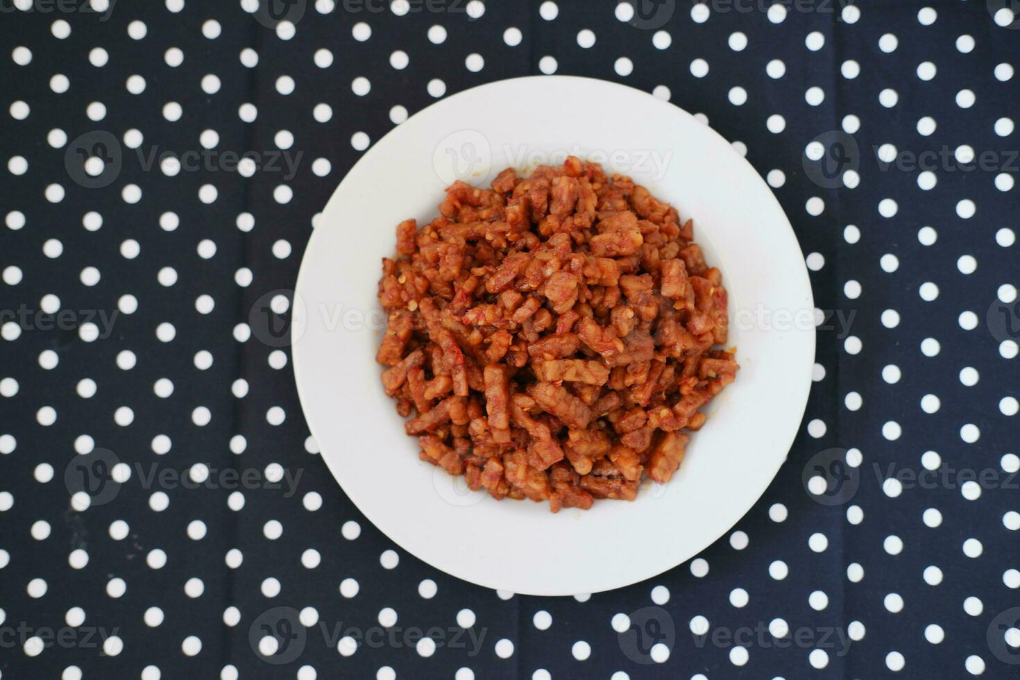 Orek tempe or Sauteed Tempeh is a typical Indonesian cuisine with herbs, garlic, onion, chilli and soy sauce. It tastes delicious photo