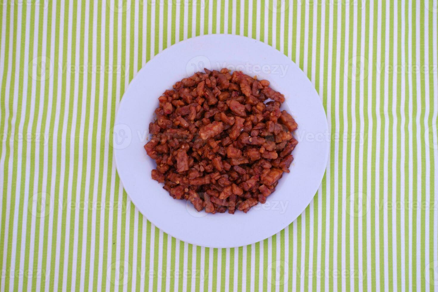 Orek tempe or Sauteed Tempeh is a typical Indonesian cuisine with herbs, garlic, onion, chilli and soy sauce. It tastes delicious photo