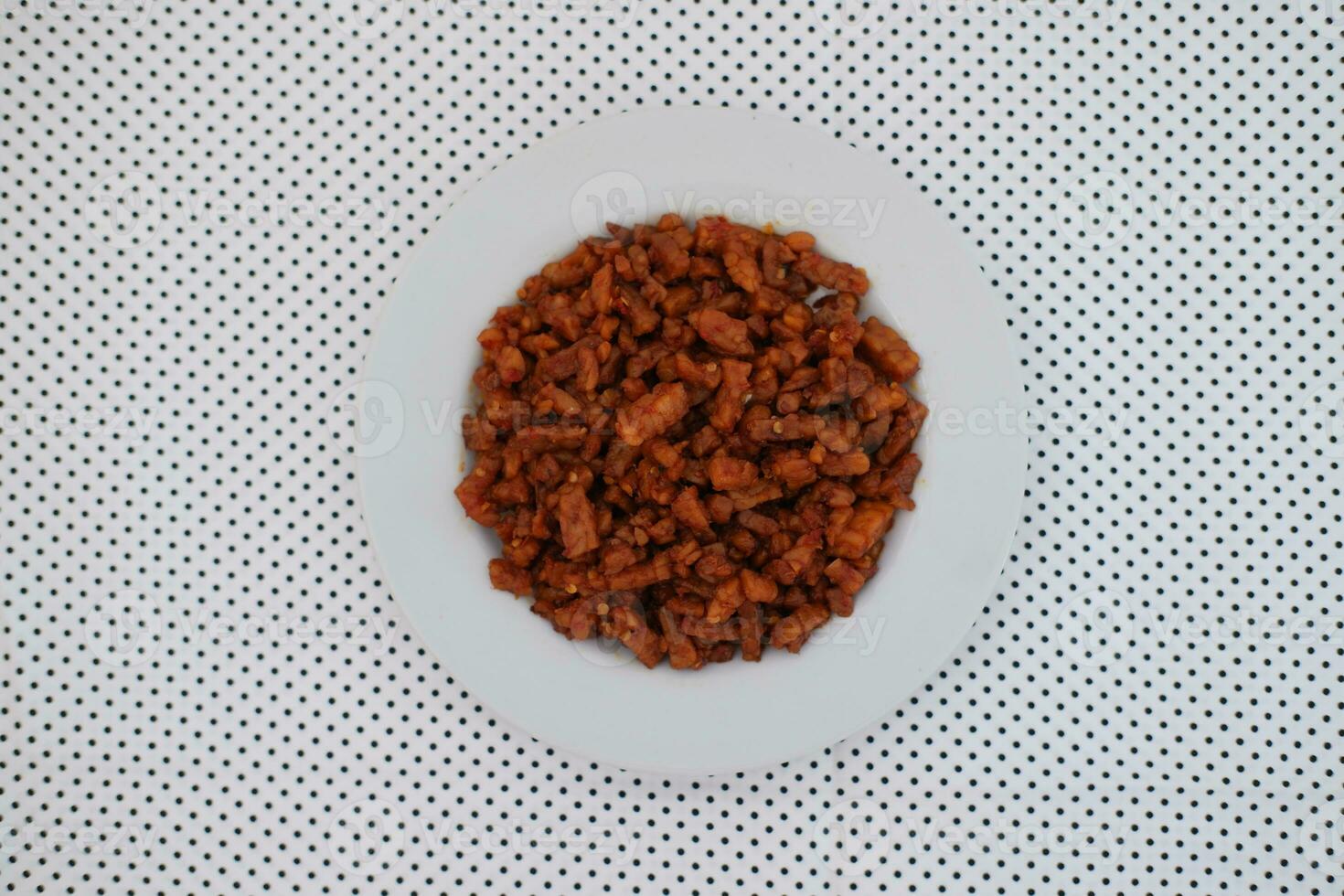 Orek tempe or Sauteed Tempeh is a typical Indonesian cuisine with herbs, garlic, onion, chilli and soy sauce. It tastes delicious photo