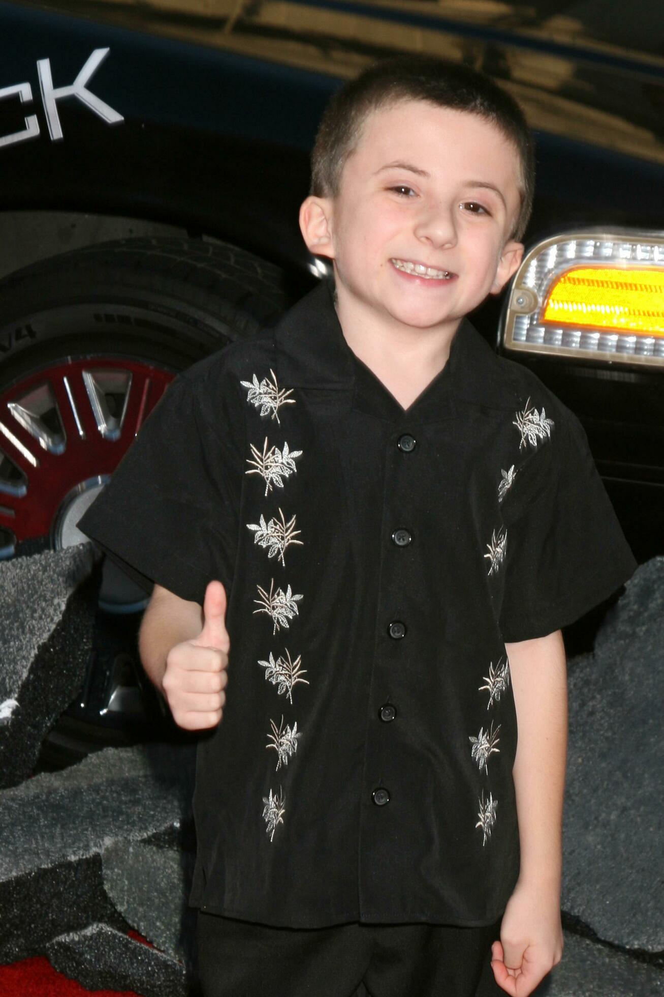 Atticus Shaffer arriving at Graumans Chinese Theater for the premiere