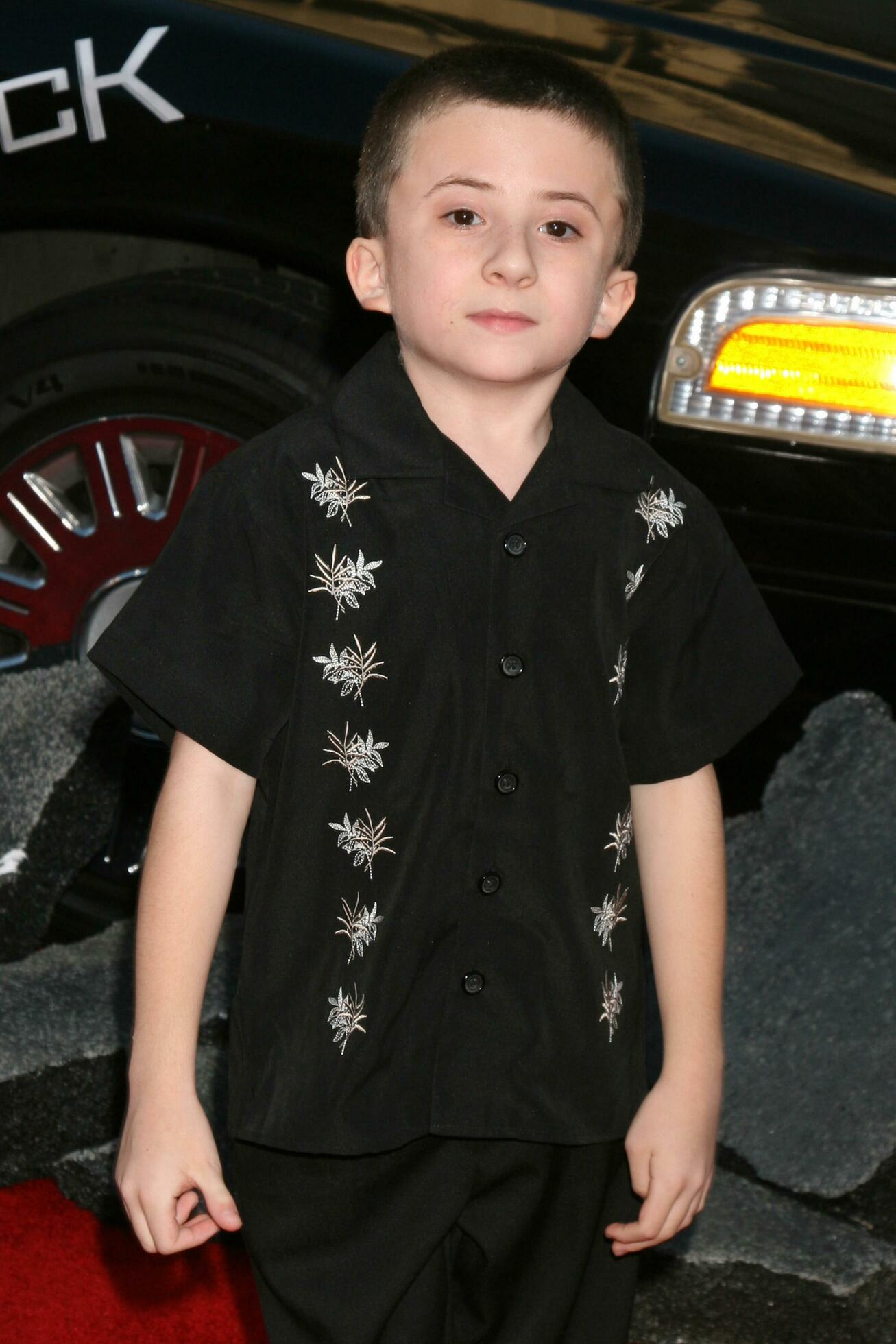 Atticus Shaffer arriving at Graumans Chinese Theater for the premiere