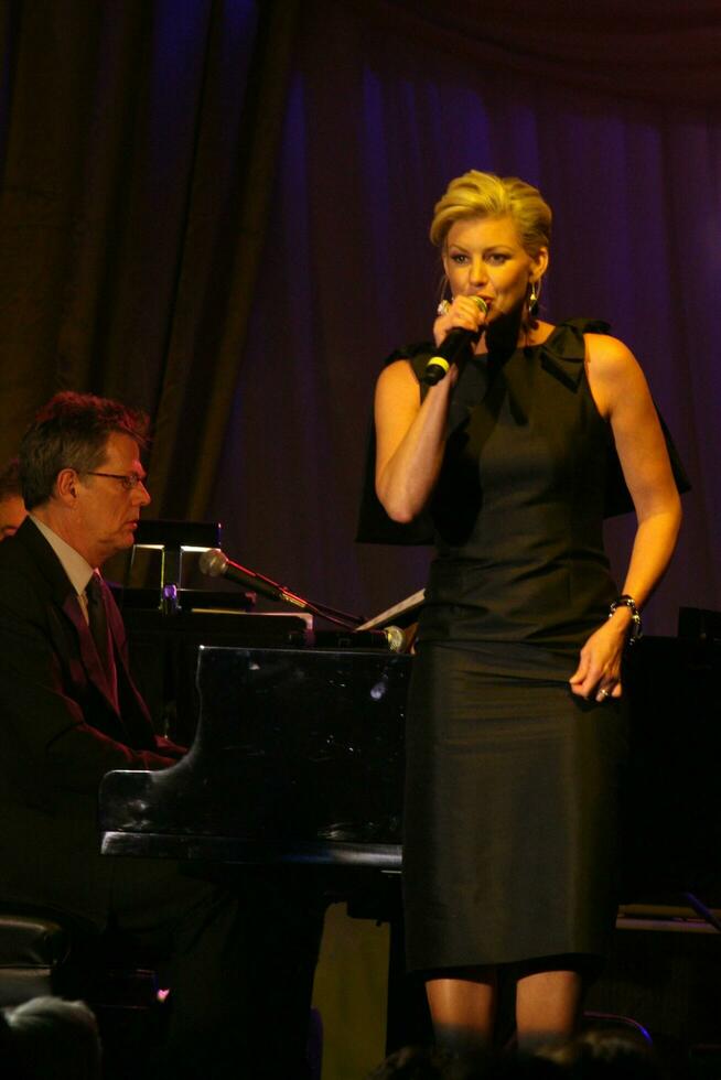 David Foster accompanies as Faith Hill performs Fight Night XIV JW Marriott Resort Phoenix AZ April 52008 photo