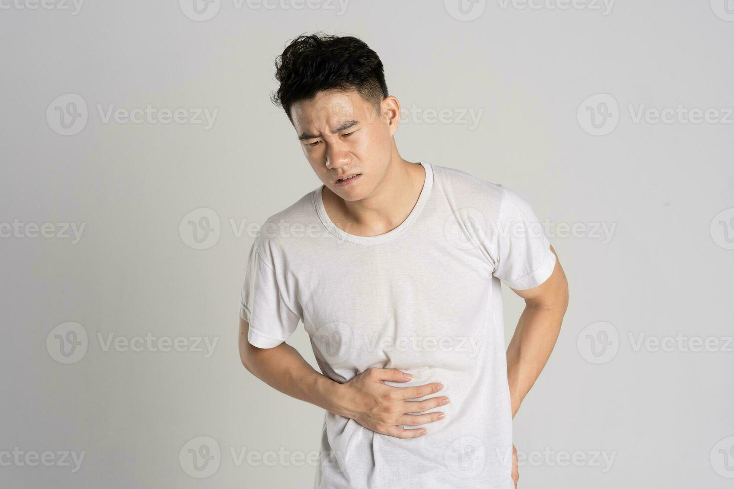 Portrait of Asian man posing on white background photo