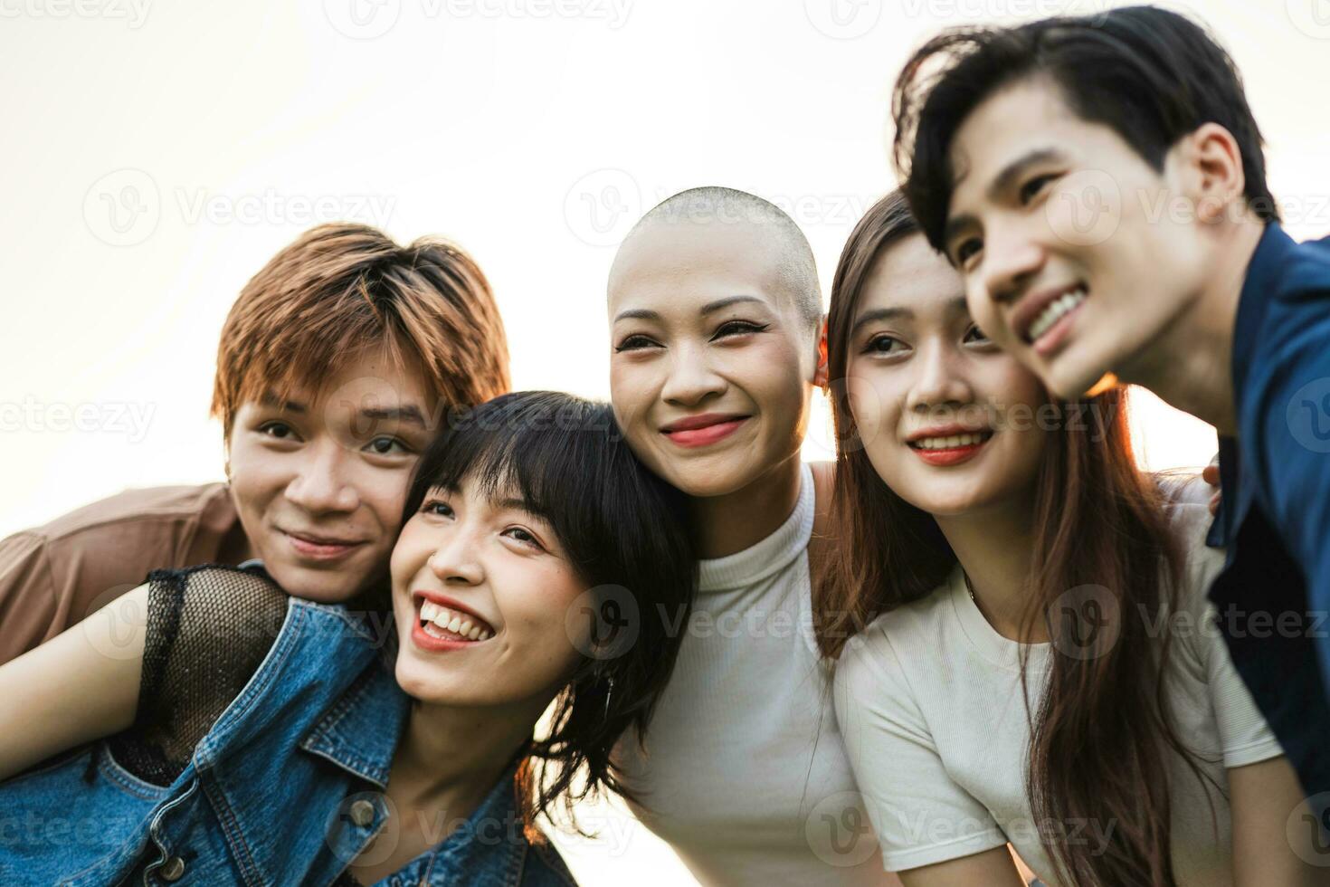 Image of a group of young Asian people laughing happily together photo