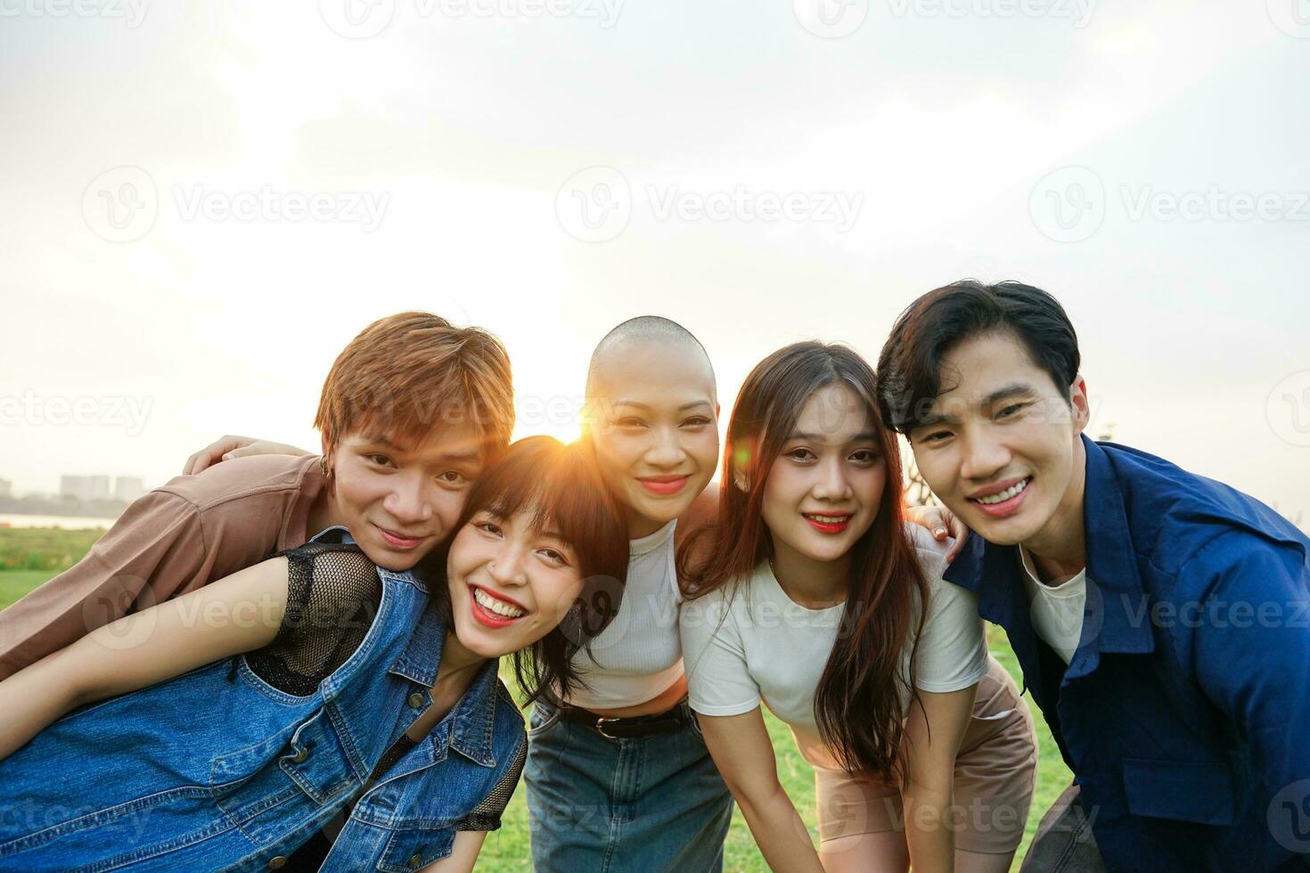 Image of a group of young Asian people laughing happily together photo