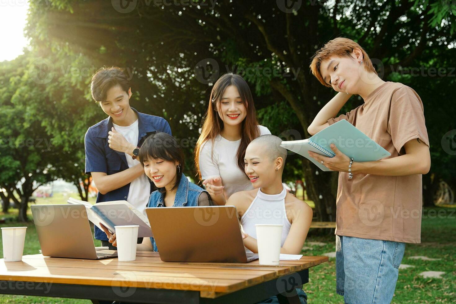Image of a group of Asian students studying together photo