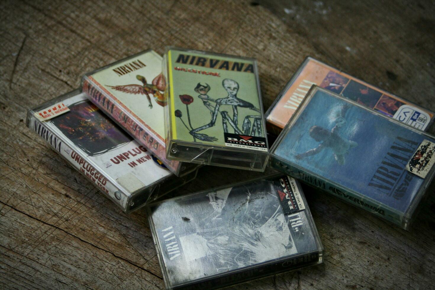 America, Washington State - September 08 2023  Nirvana cassette tape on wooden floor, Nirvana band, Kurt Cobain, Nirvana songs, In Uthro photo