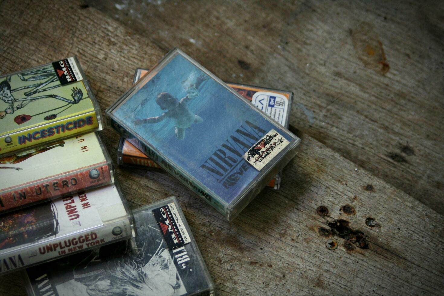 America, Washington State - September 08 2023  Nirvana cassette tape on wooden floor, Nirvana band, Kurt Cobain, Nirvana songs, In Uthro photo