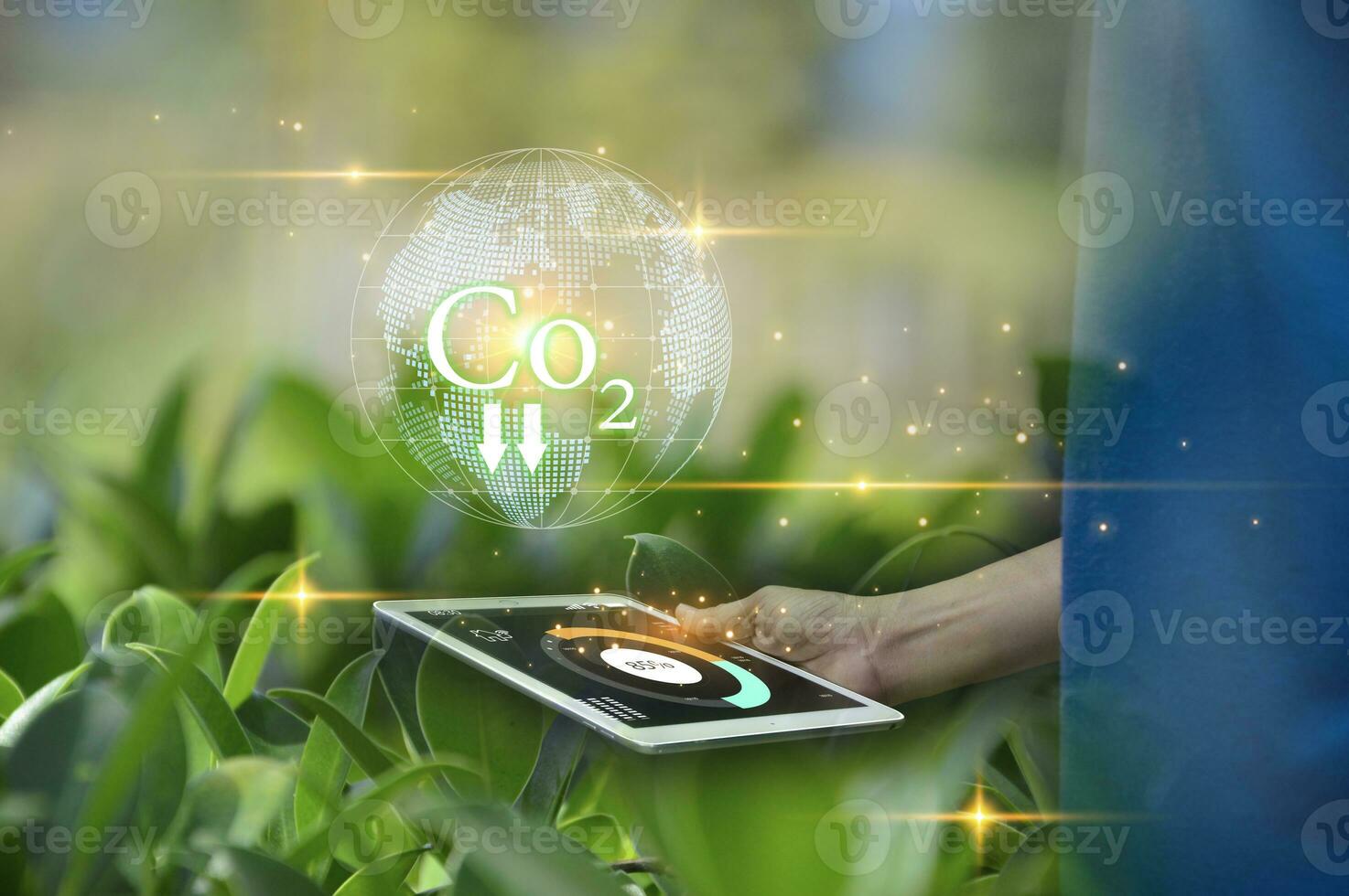 Concept of reducing CO2 emissions on hand for the environment, global warming, sustainable development and green business from renewable energy photo