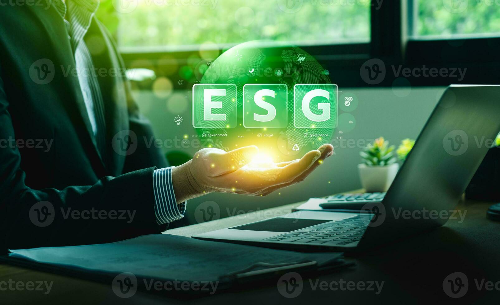 ESG environment social governance investment concept. Businessman using computer to analyze investment ESG. strategy that considers the environmental, company carbon labor practices, sustainability photo