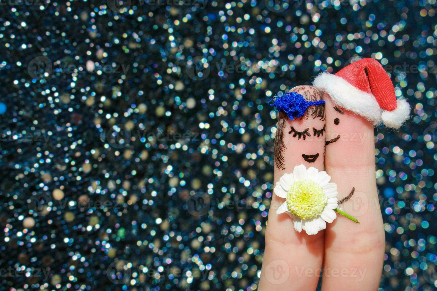 Finger art of Happy couple. Man is giving flowers to woman photo