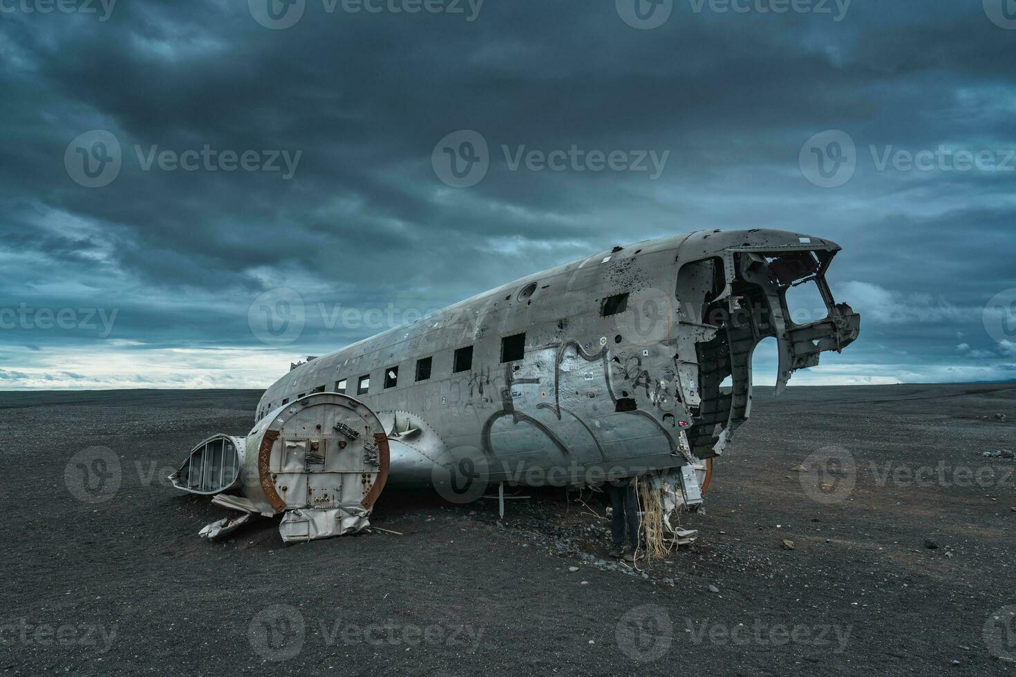 Crashed military DC 3 plane wreck on black sand beach in Iceland photo