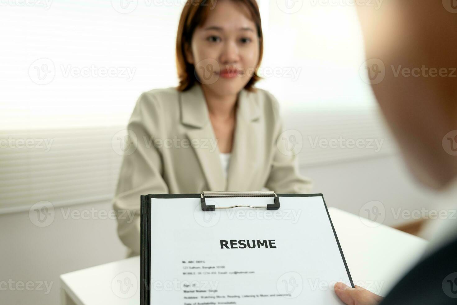 Executives accept job application documents and read job applicants resume to match the position. company publishes vacancies online to find human. Human resource, interview, letters, competence. photo