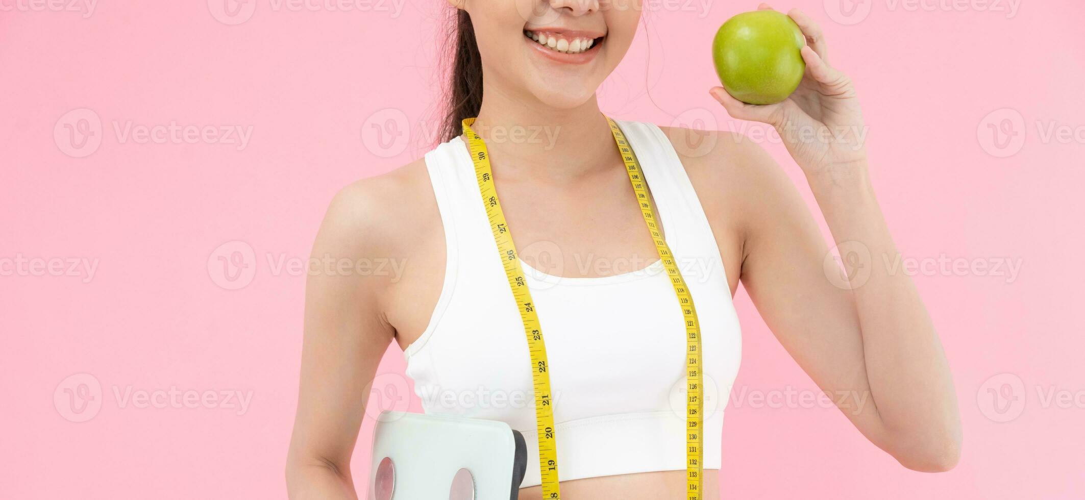 slim body asian women choose healthy foods, dieting female choose green apple for diet. Good healthy food. weight lose, balance, control, reduce fat, low calories, routines, exercise, body shape. photo