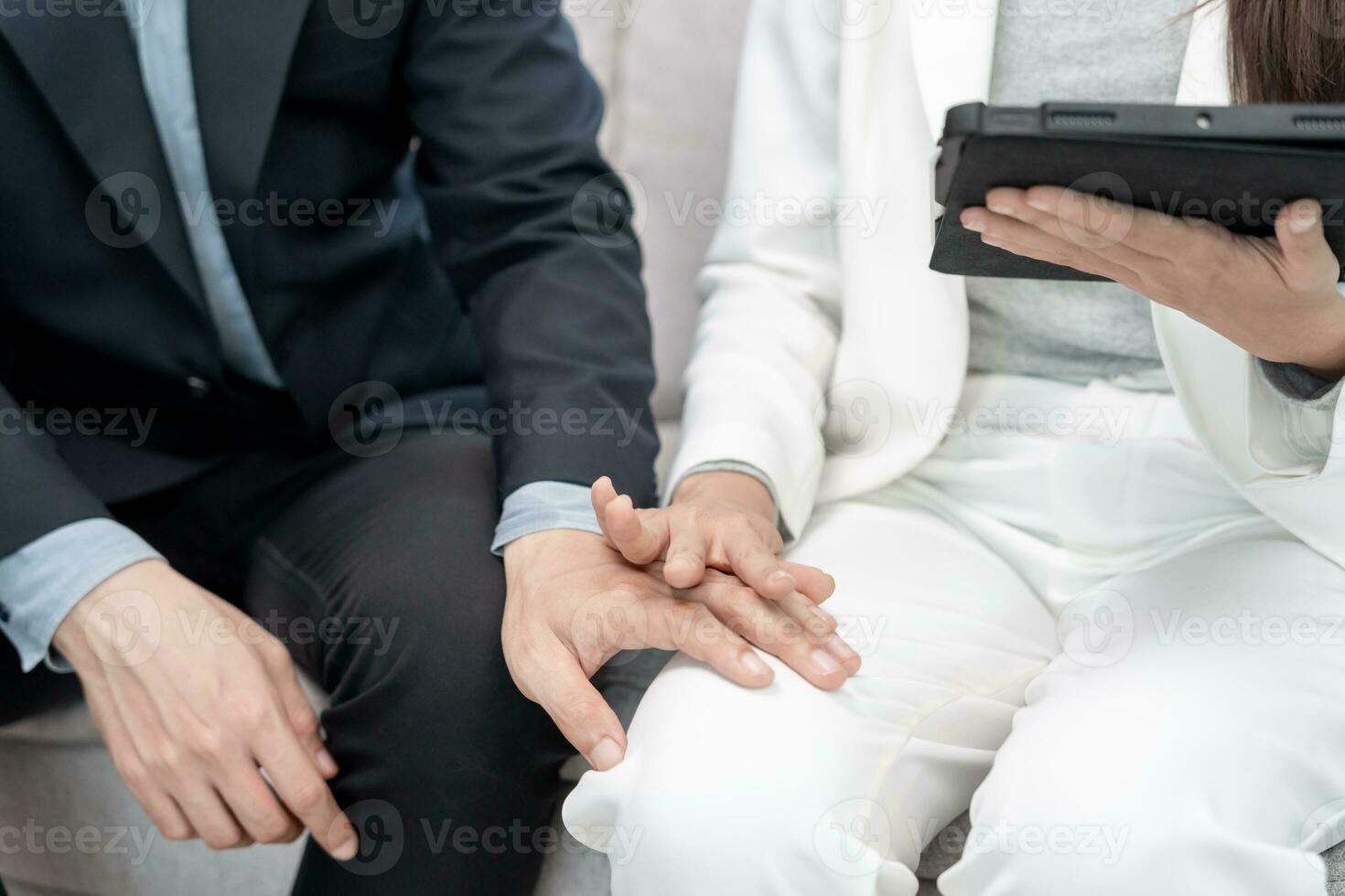 Manager or senior sexually harassed a female colleague by touch her leg. Sexual harassment in office. feel anxious and stressed from being harassed. molest, assault, inappropriate, discrimination photo