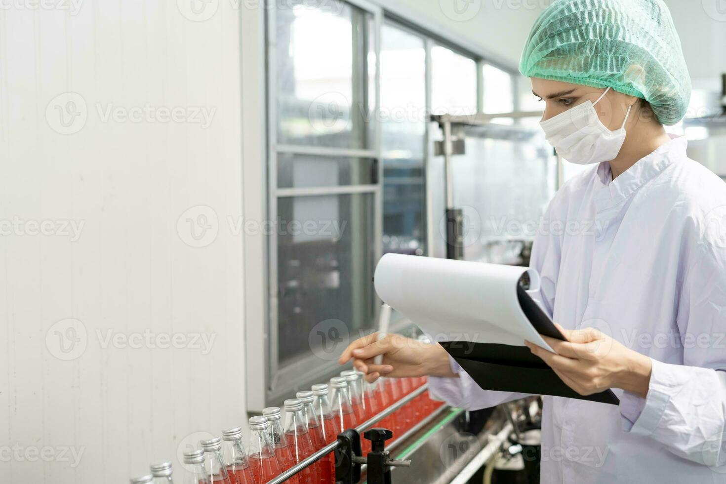 quality inspector food or beverages technician inspection about quality control food or beverages before send product to the customer. Production leader recheck ingredient and productivity. photo