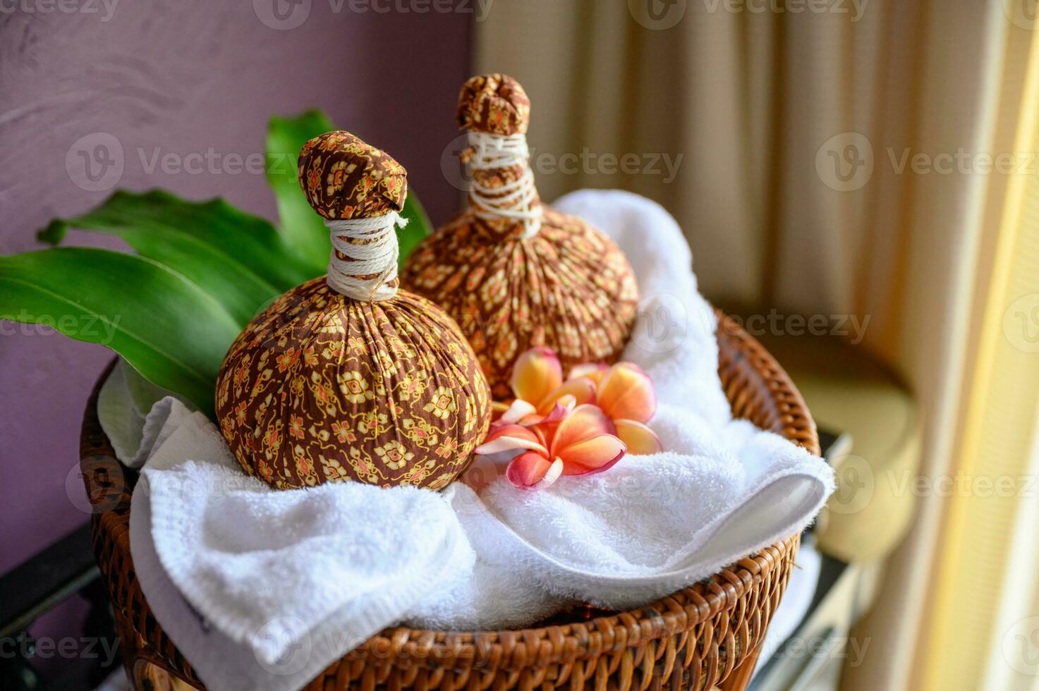 Thai massage with herbal hot compress ball photo