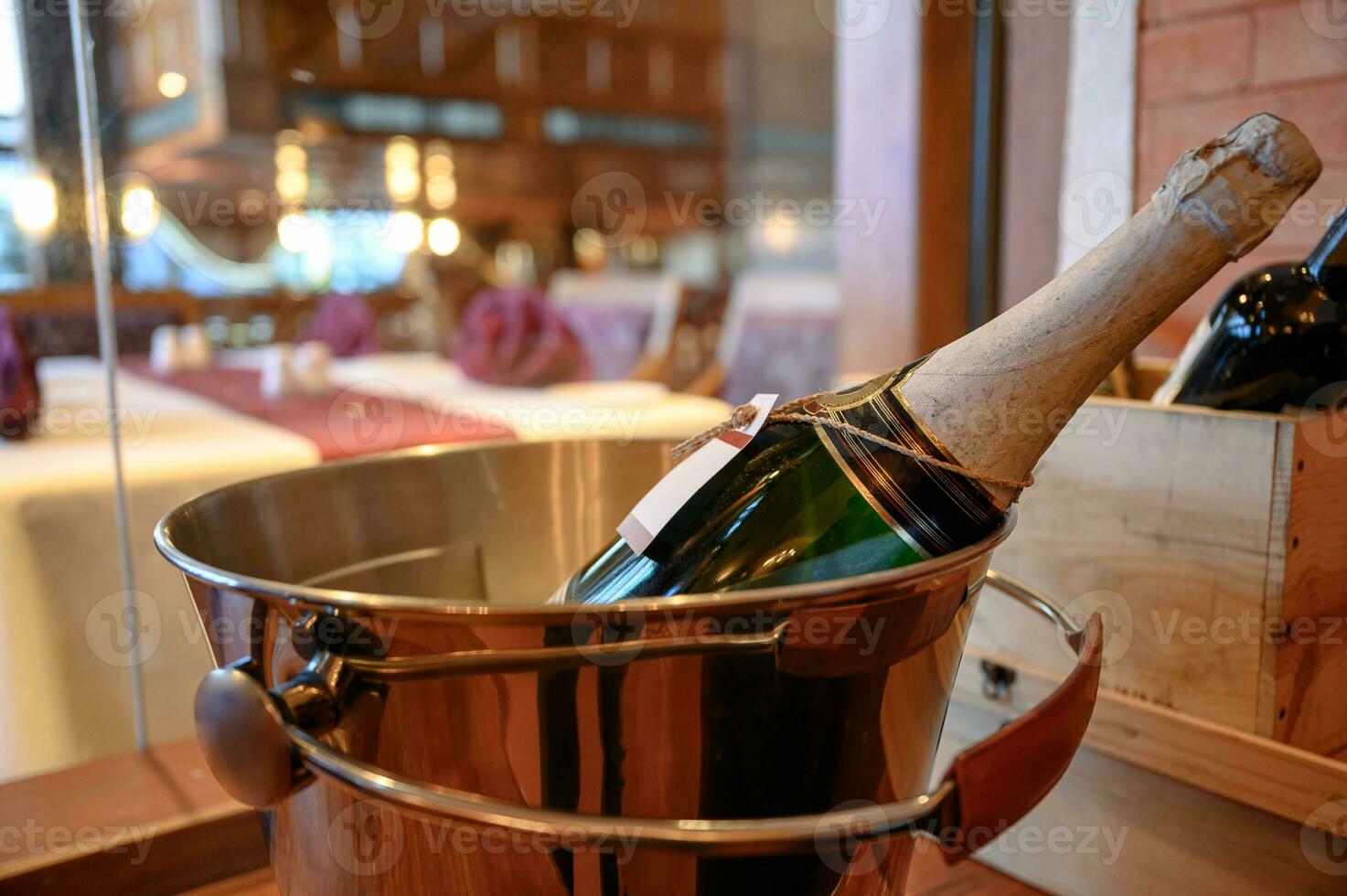 Champagne bottle soaking in bucket photo