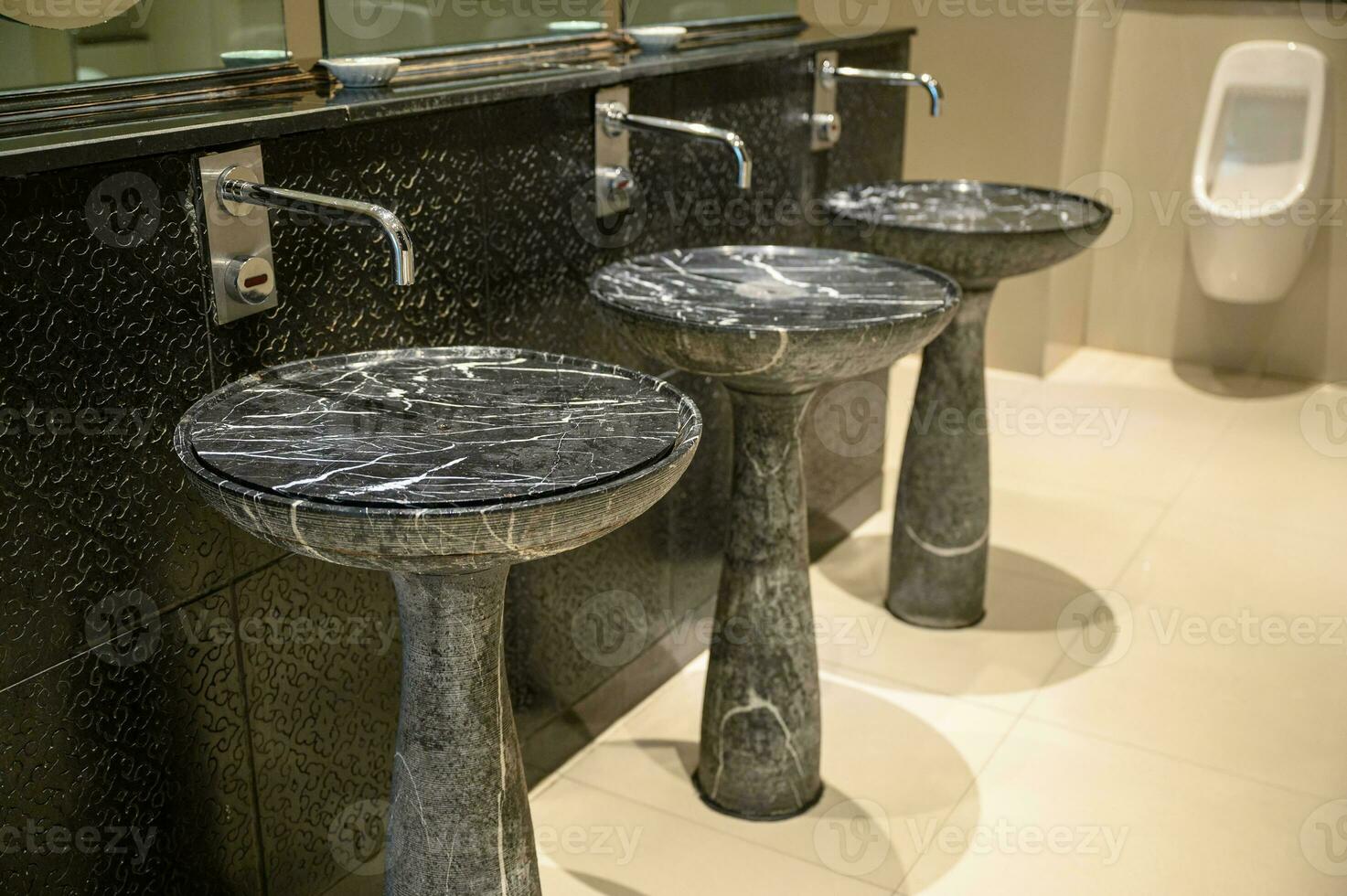 Luxury marble stone vessel sink with stainless faucet in toilet photo