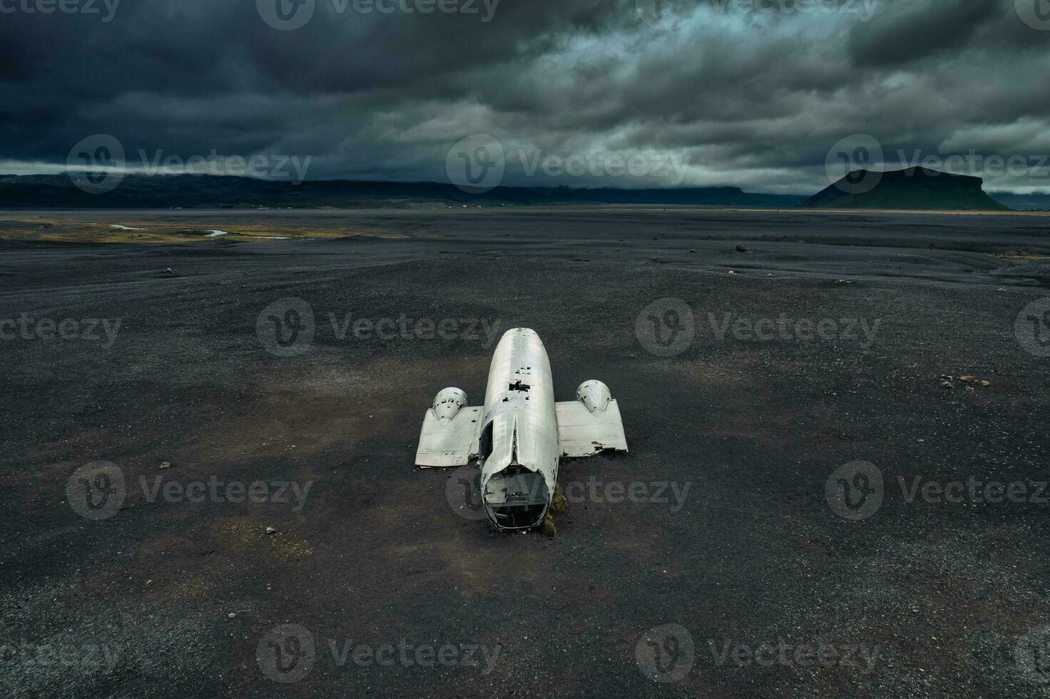 Crashed military DC 3 plane wreck on black sand beach in Iceland photo