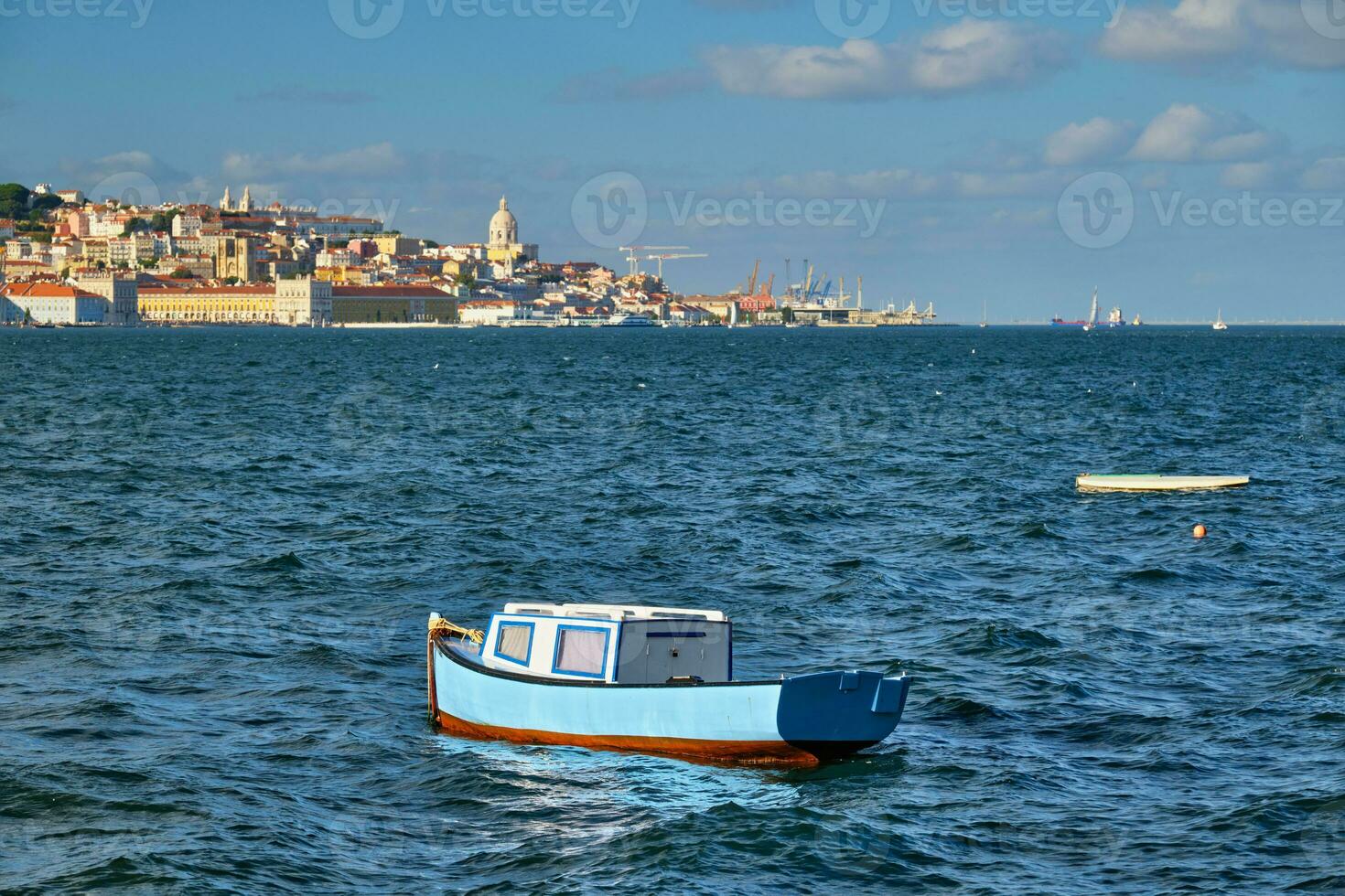 View of Lisbon view over Tagus river with yachts and boats at sunset. Lisbon, Portugal photo