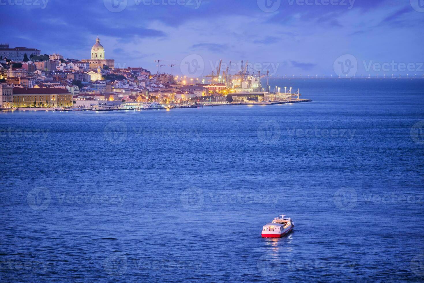 View of Lisbon view over Tagus river with yachts and boats at sunset. Lisbon, Portugal photo