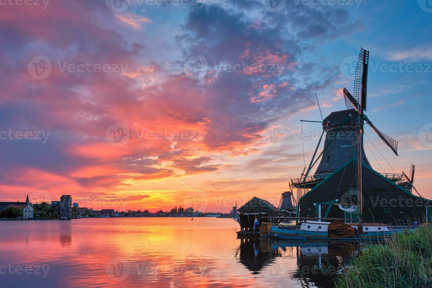 Windmills at Zaanse Schans in Holland on sunset. Zaandam, Nether photo