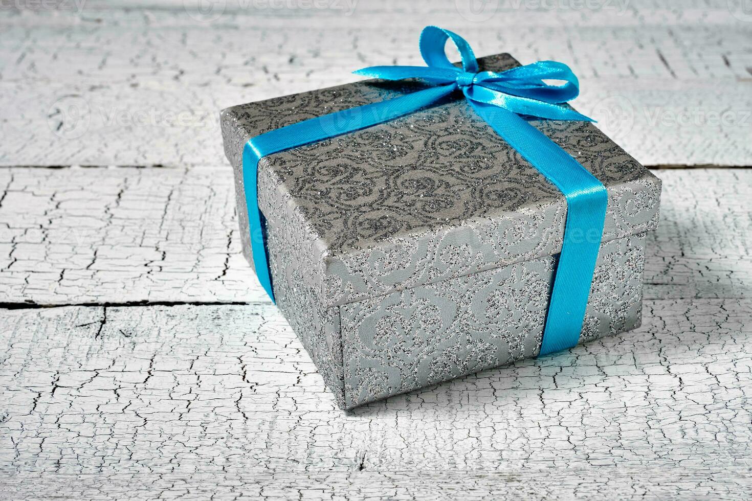 Gift box with blue ribbon photo