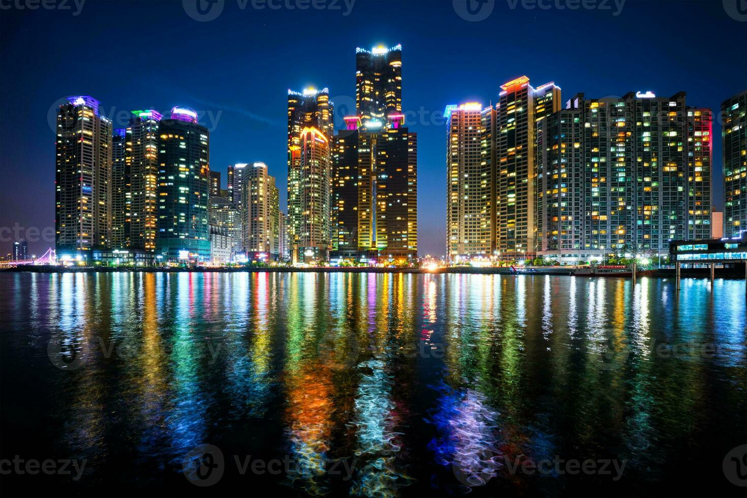 Busan Marina city skyscrapers illluminated in night photo