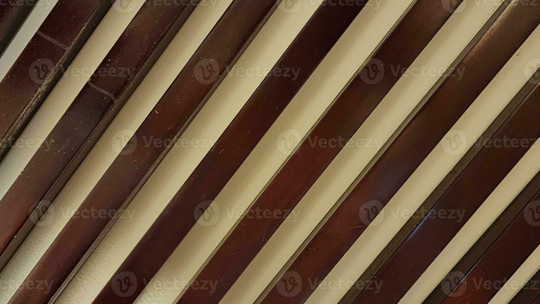 Close up of a red and brown striped wall with vertical stripes. photo